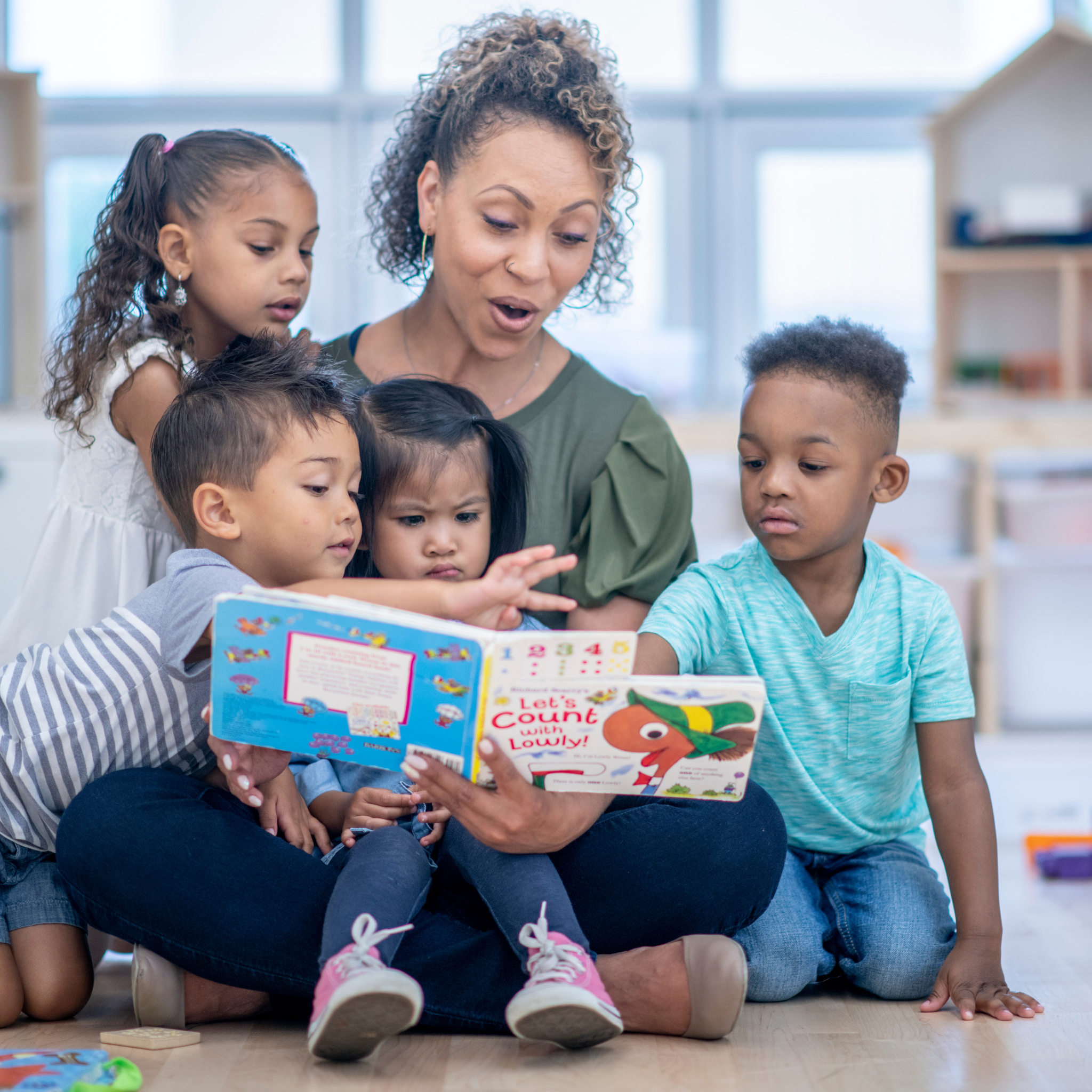 Teacher reading to children, deserving of the self published children's picture book titled "You're More Than My Teacher" from Amazon KDP and Kindle Direct Publishing